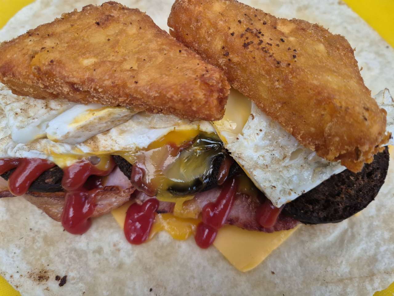 Scran Van signature breakfast sandwich with crispy hash browns